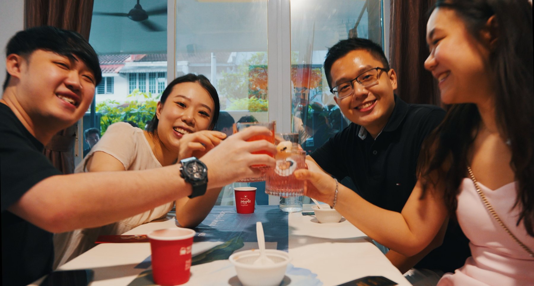 Guests cheering with drinks at a private celebration